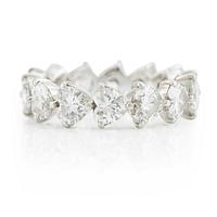 A Graff platinum eternity band set with heart shaped diamonds.