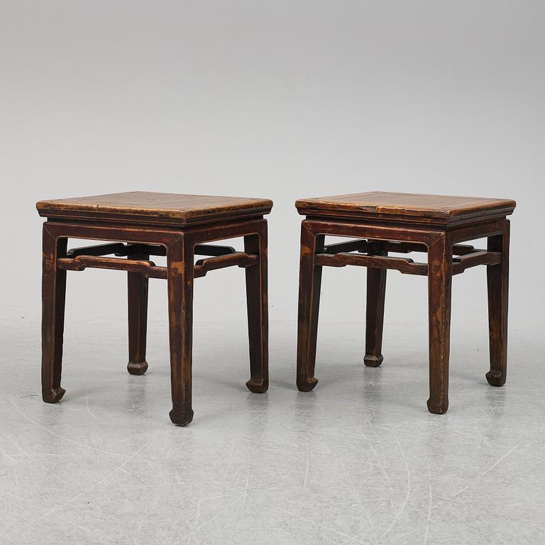 A pair of hardwood tables, 20th century.