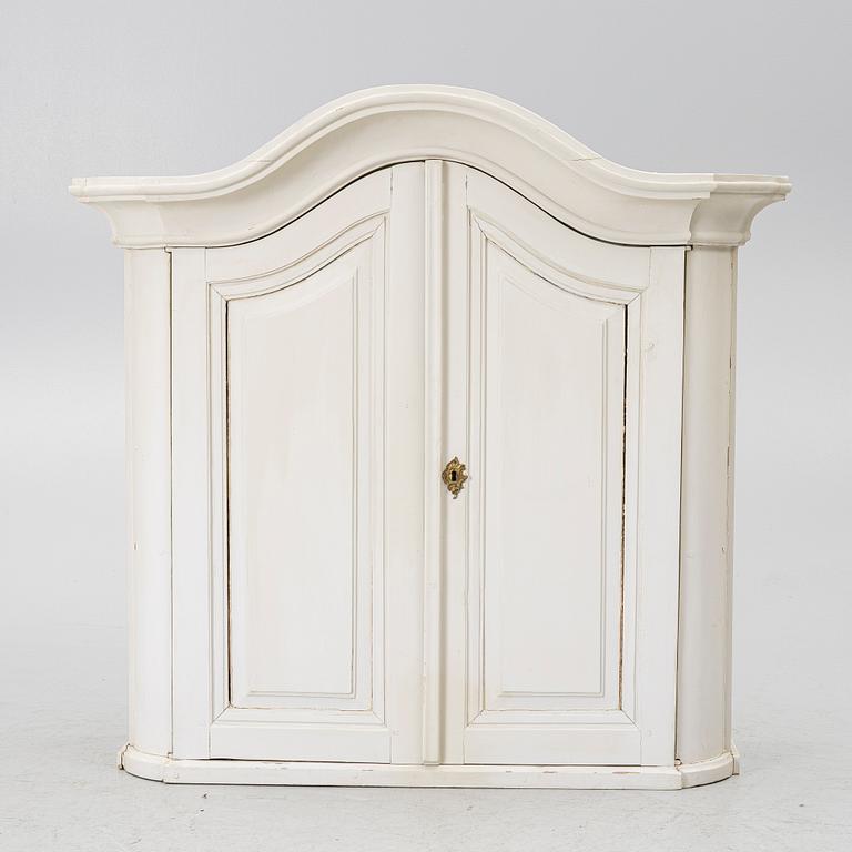 A Swedish rococo hanging cabinet, mid 18th century.