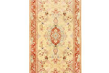 A Tabriz carpet, part silk, 50 raj, a. 508 x 85 cm.