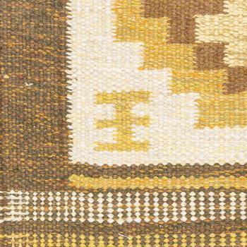 A flat weave carpet, signed EE, ca 242 x 170 cm.