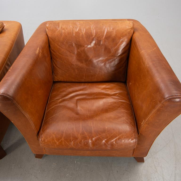 A pair of Lederland leather armchairs Netherlands later part of the 20th century.