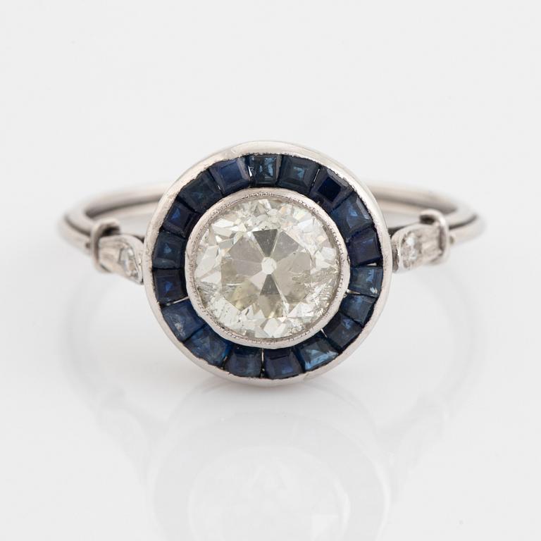 Platinum and brilliant cut diamond and step cut sapphire ring, ca 1920's.