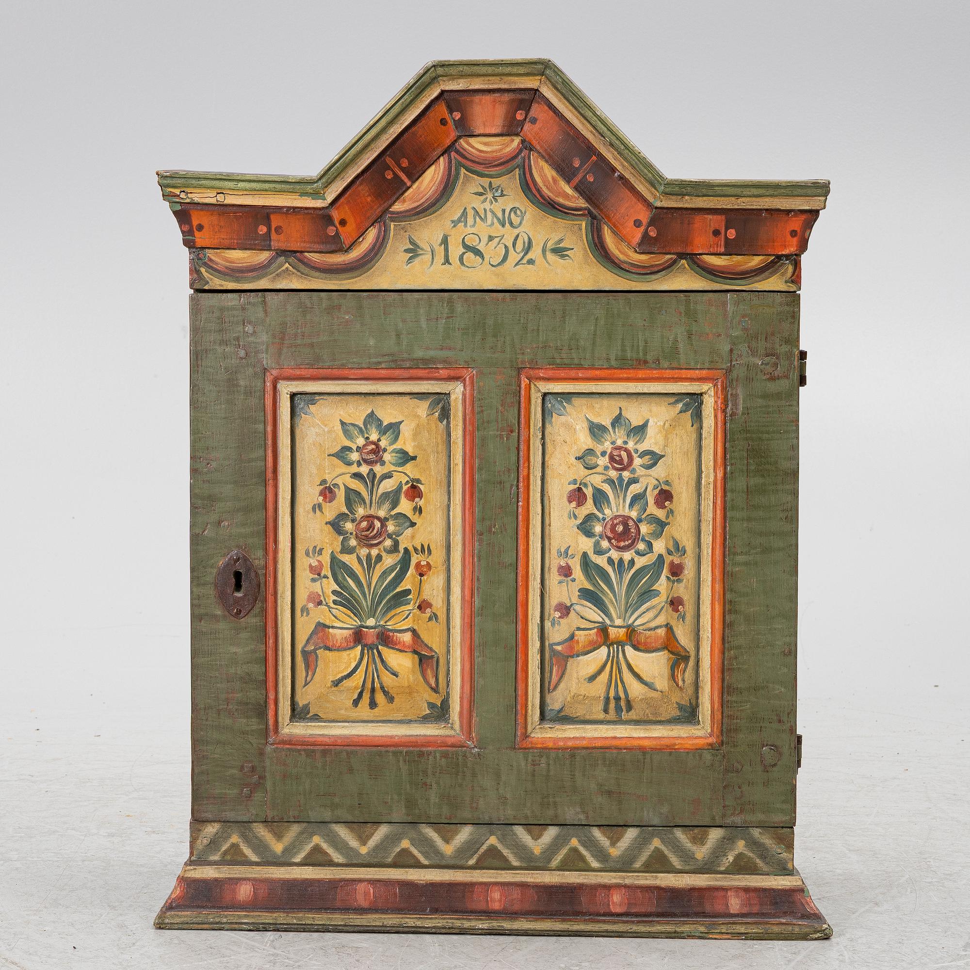 A hanging cabinet, dated 1832.