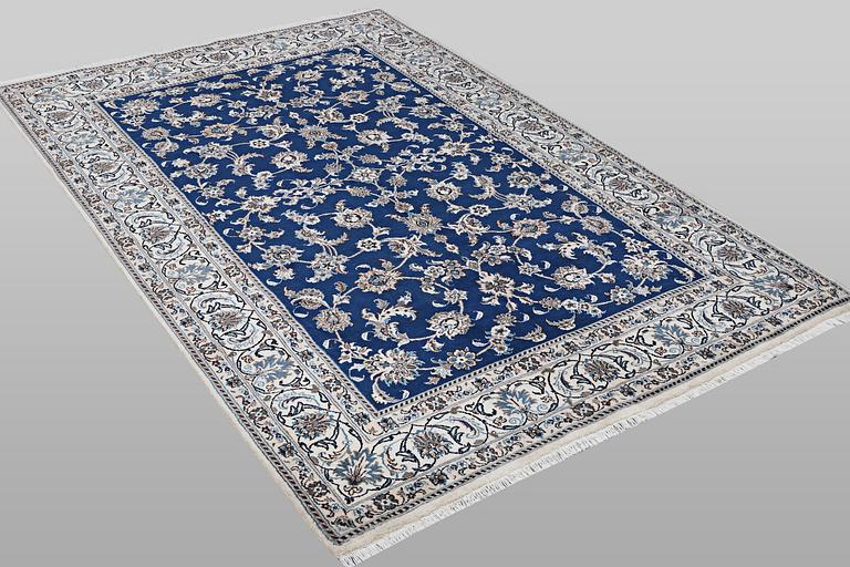 A carpet, Nain, part silk, ca 297 x 194 cm.