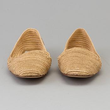 A pair of raffia shoes by Emma Hope's.