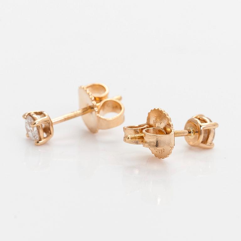 Tiffany & Co, örhängen, "Tiffany Solitaire", 18K guld och briljantslipade diamanter.