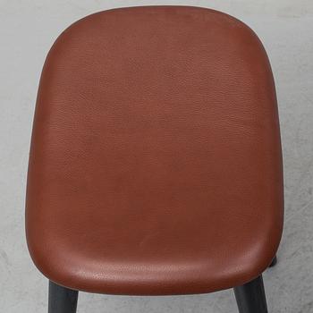 Four contemporary leather upholstred stools by Berlin & Iskos for Muuto.