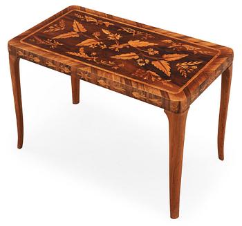 796. A Carl Malmsten mahogny table with inlays of different exotic woods, Sweden 1935.