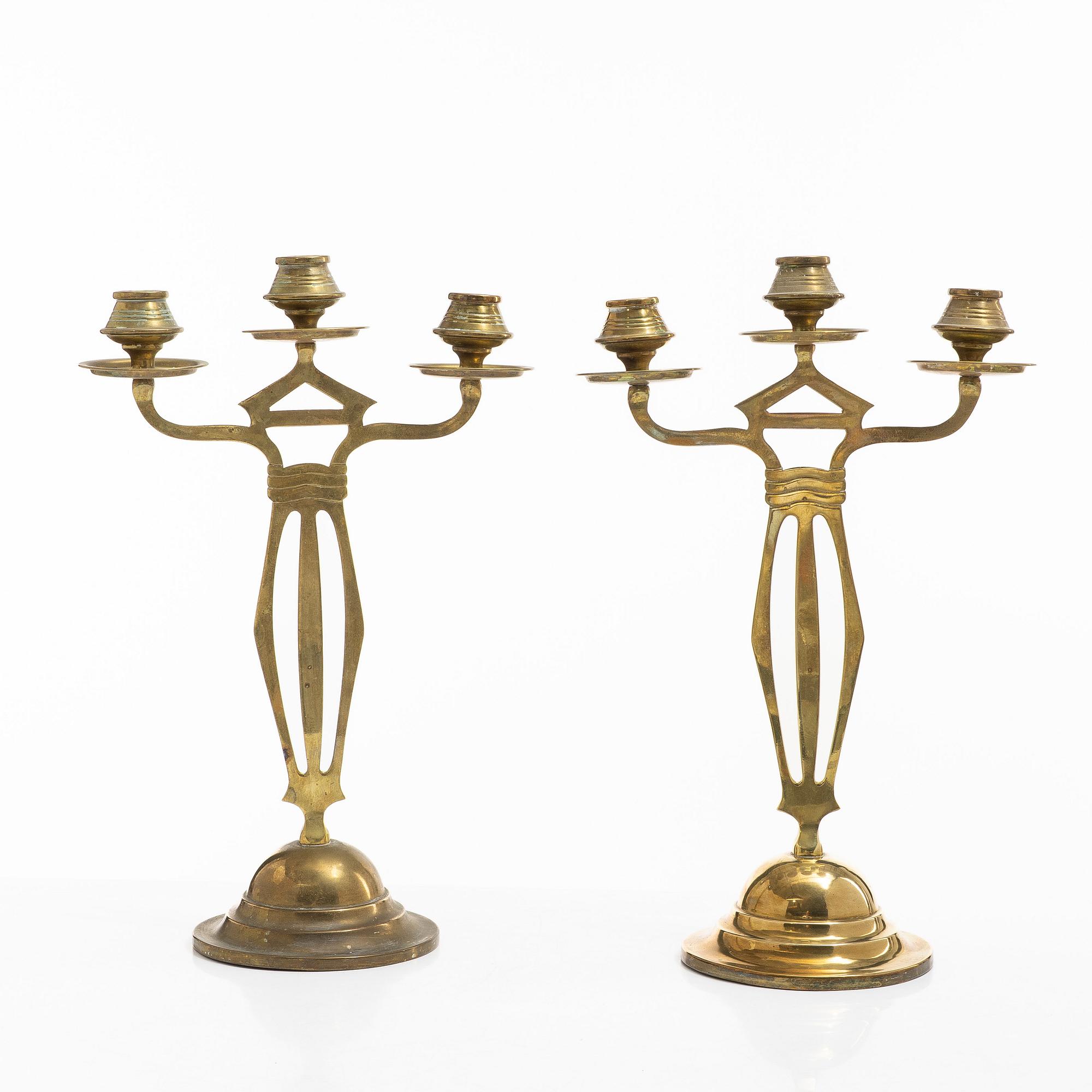 Jugend/Art Nouveau, A pair of brass candelabra, early 20th century.