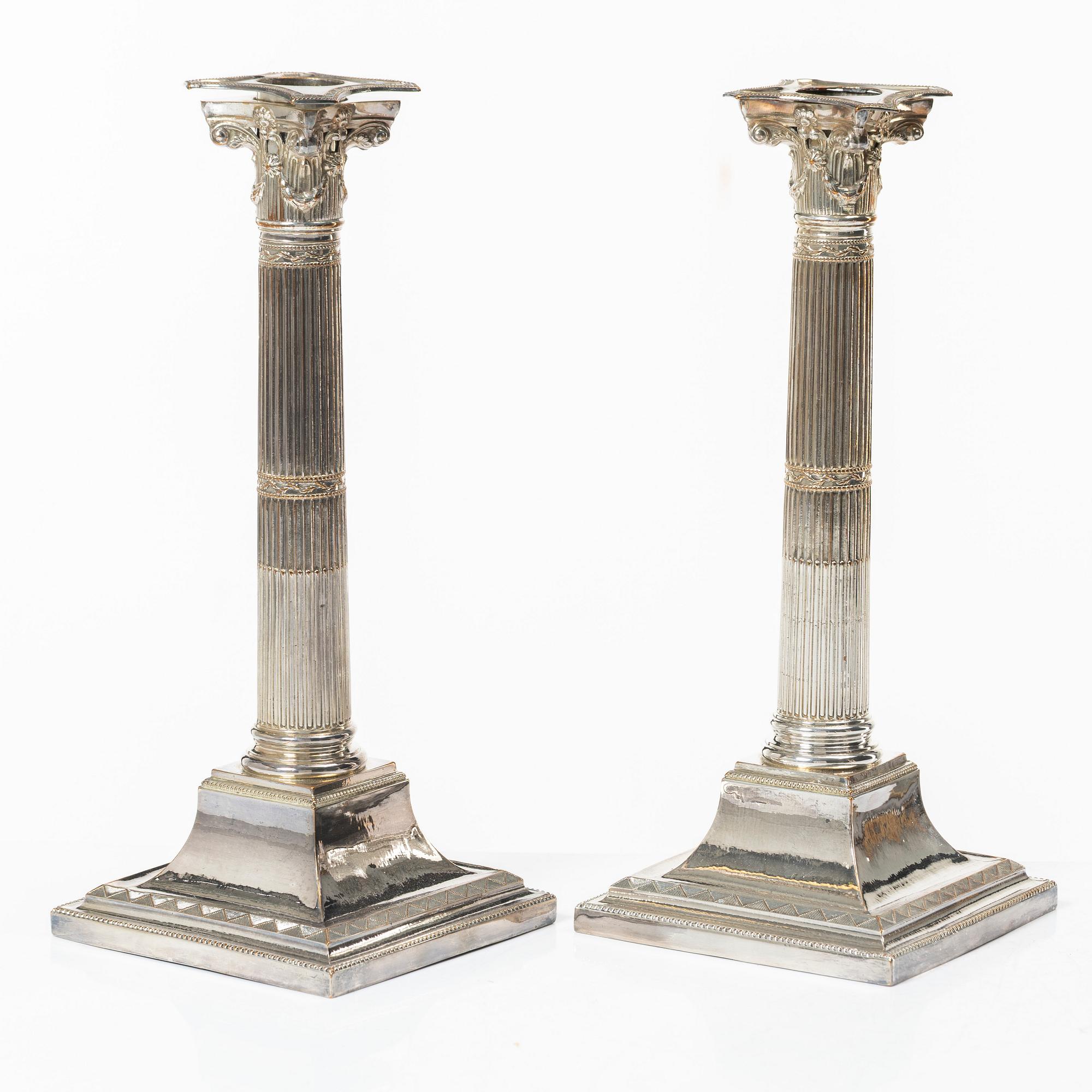 Four silver plated candlesticks, early 20th century.