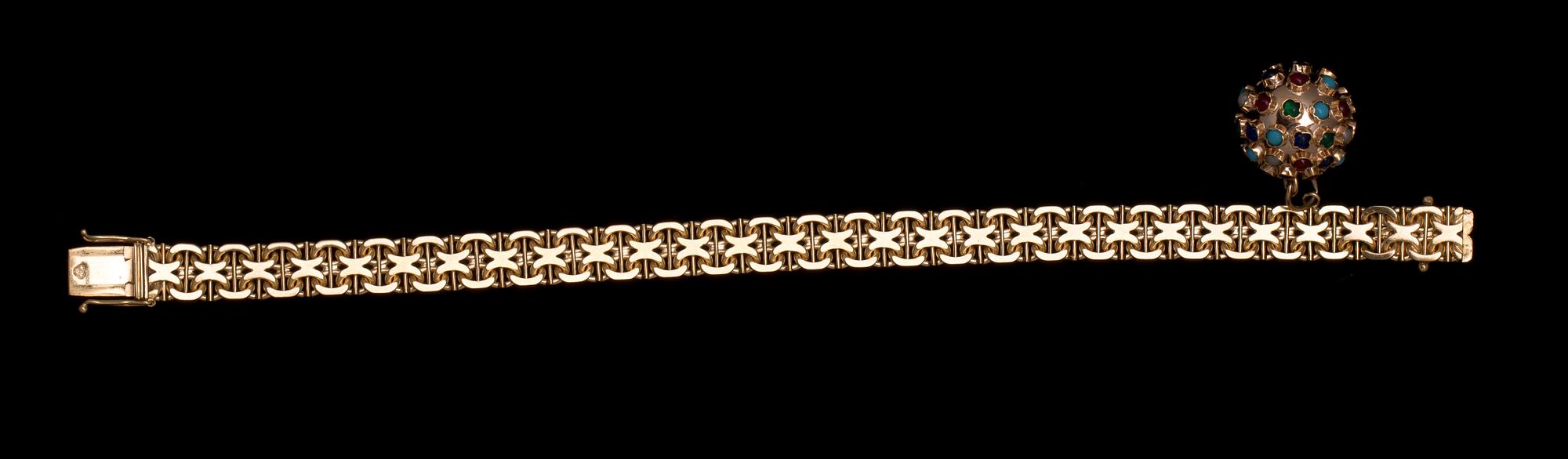 ARMLÄNK MED BERLOCK, 18 k guld samt cabochonslipade stenar. Segir, Köping, 1962. Vikt ca 25 g.