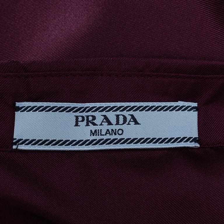 Prada, a burgundy silk blouse, size 36.