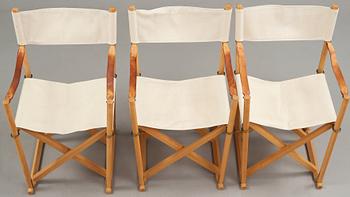 Mogens Koch, a set of six beech and canvas 'MK16' folding chairs, comes with a stand for storage, Rud Rasmussen, Denmark.