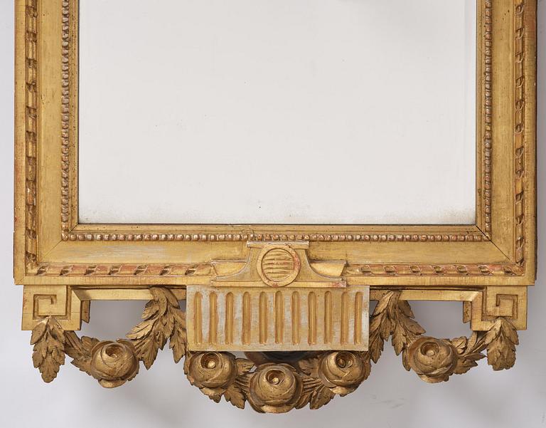 A Gustavian giltwood mirror, Stockholm, late 18th century.