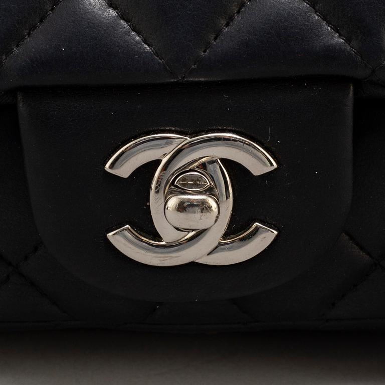 CHANEL, a black leather 'Extra mini flap bag' 2012-13.