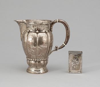 586. KANNA samt TÄNDSTICKSHÅLLARE, silver. George Jensen respektive importstämplat CG Hallberg, 1919.