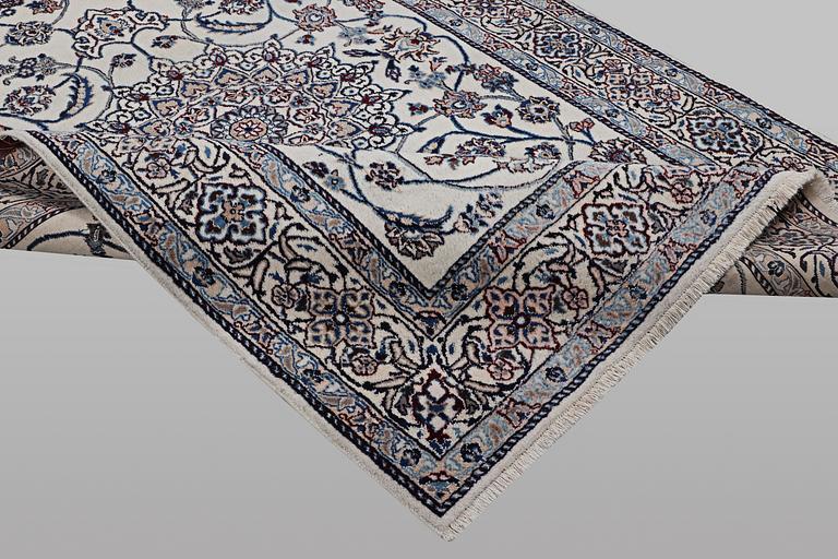 A carpet, Nain, part silk, 9 laa, ca 290 x 196 cm.