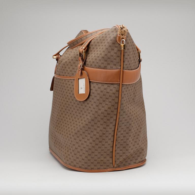 GUCCI, a monogram canvas weekendbag.