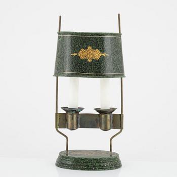 An empire style candlestick, circa 1900.