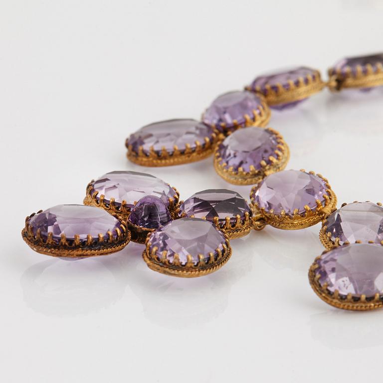 A necklace and a pair of earrings in silver set with amethysts.