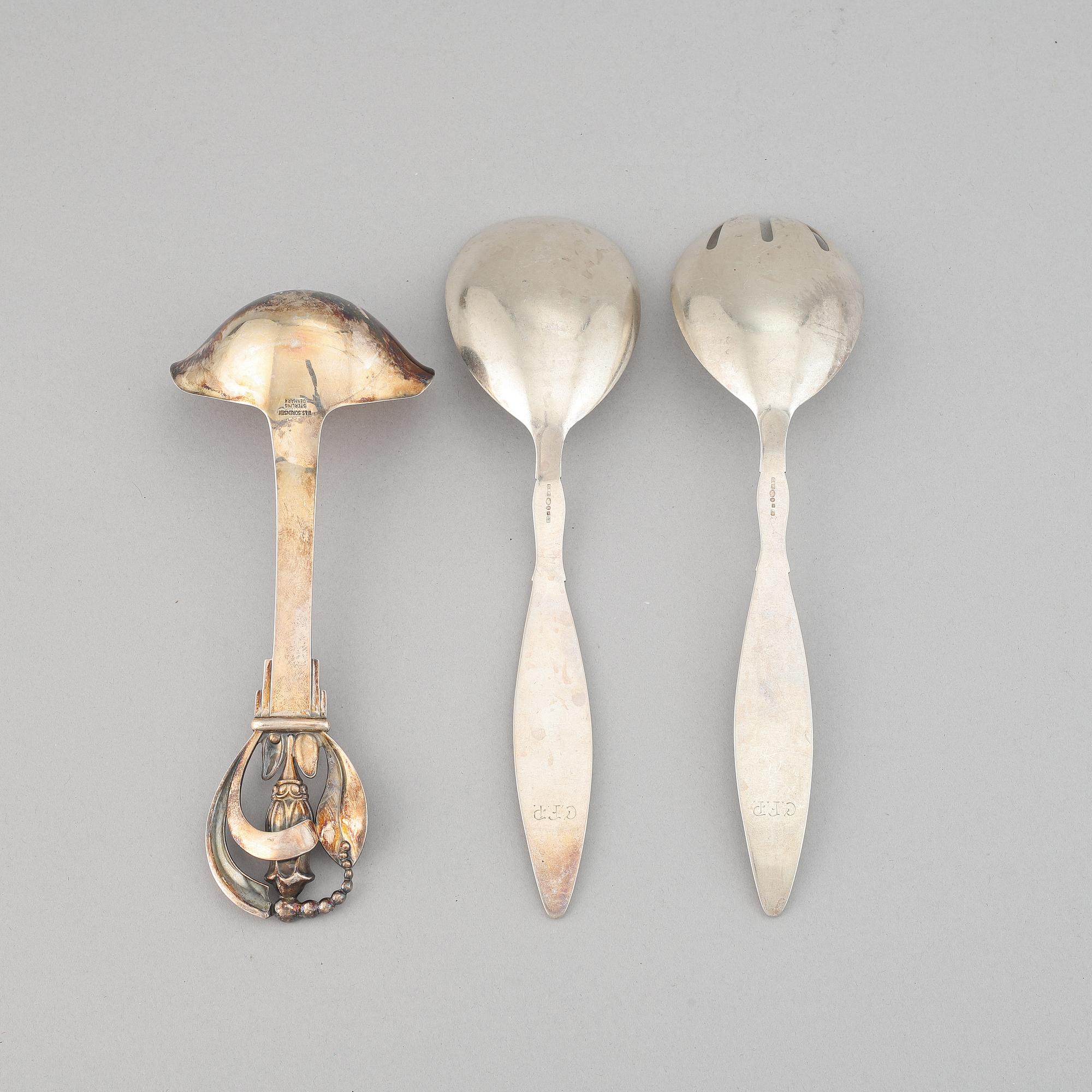 A pair of silver sallad utensils by C.G.Hallberg, Malmö, 1931, and sauce spoon W&S Sorensen, Danmark, early 20th century.