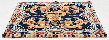 A Chinese small square rug, semi-antique, 65 x 68 cm.