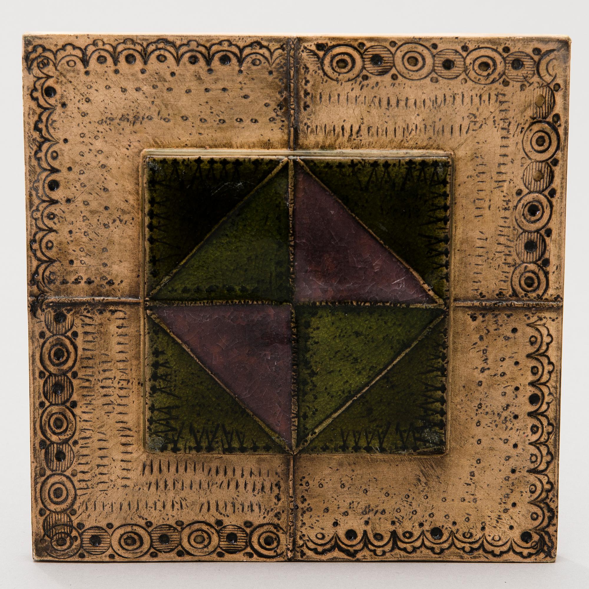 A stoneware relief signed BRYK.