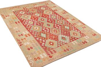 A Kelim carpet, c. 292 x 202 cm.