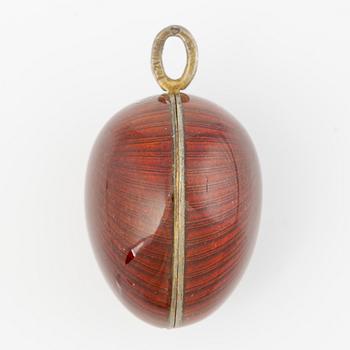 Pendant in the shape of an egg, silver with red enamel.