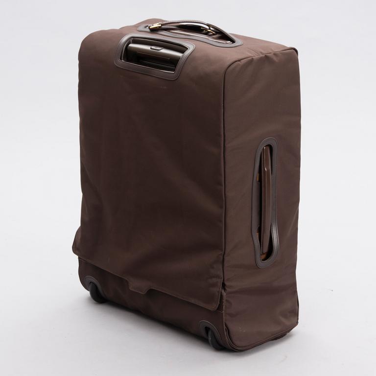 LOUIS VUITTON Damier Ebene Brown Pégase Suitcase with protective cover.
