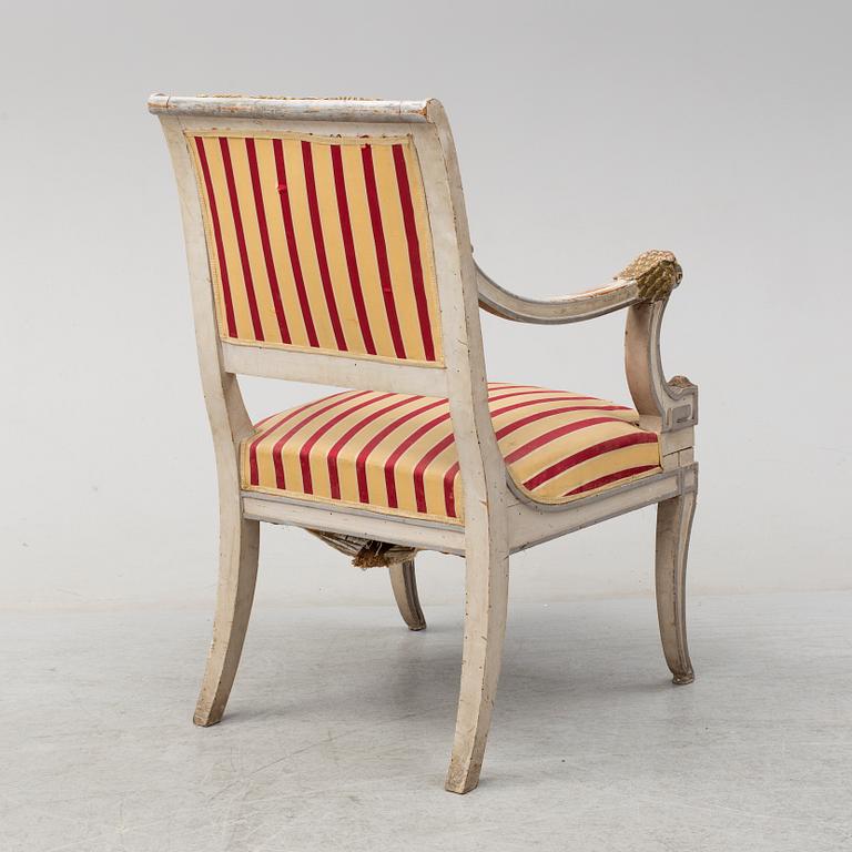 An Italian 19t century painted and scupted armchair.