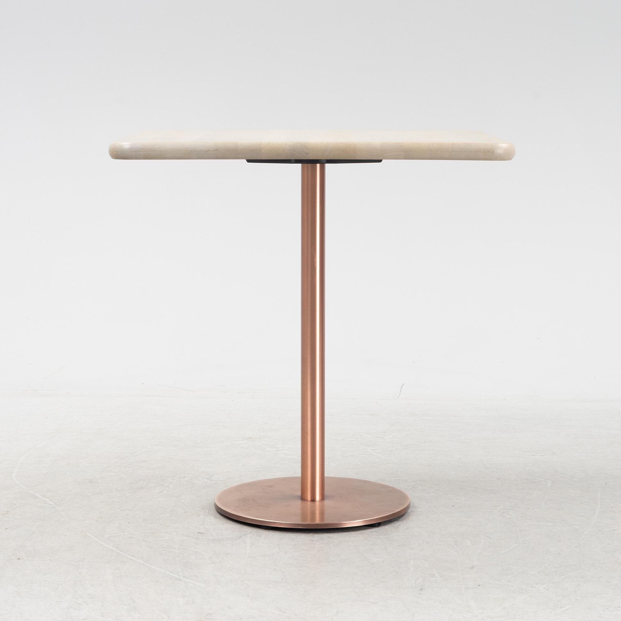 A steel and oak table by Jonas Lindvall 2011.