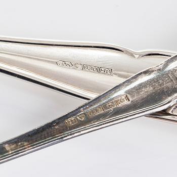 A 21-piece set of 'Chippendale' silver cutlery, and 11 silver coaster, Turku and Hämeenlinna, 1983-90 and 1964.