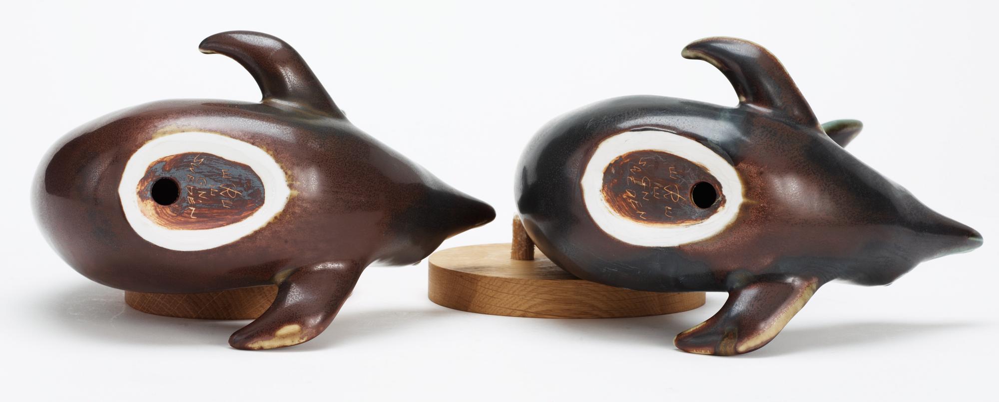 Two Gunnar Nylund stoneware figures of dolphins, Rörstrand.