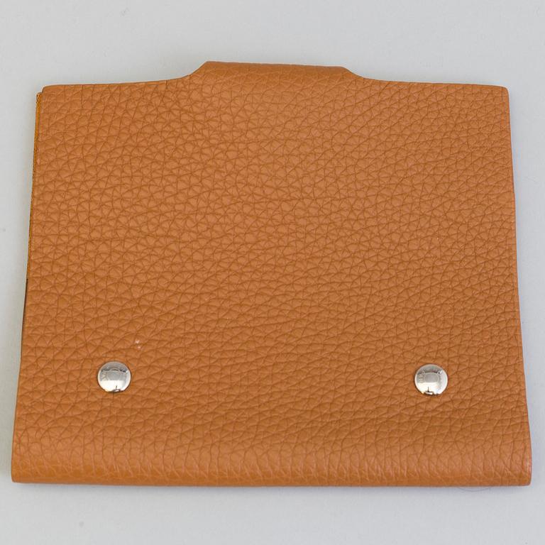 A leather Hermès notebook case.