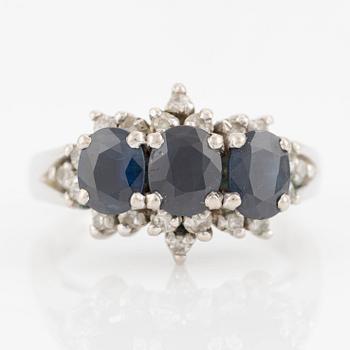 Ring, 18K white gold with small octagon-cut diamonds and dark sapphires.