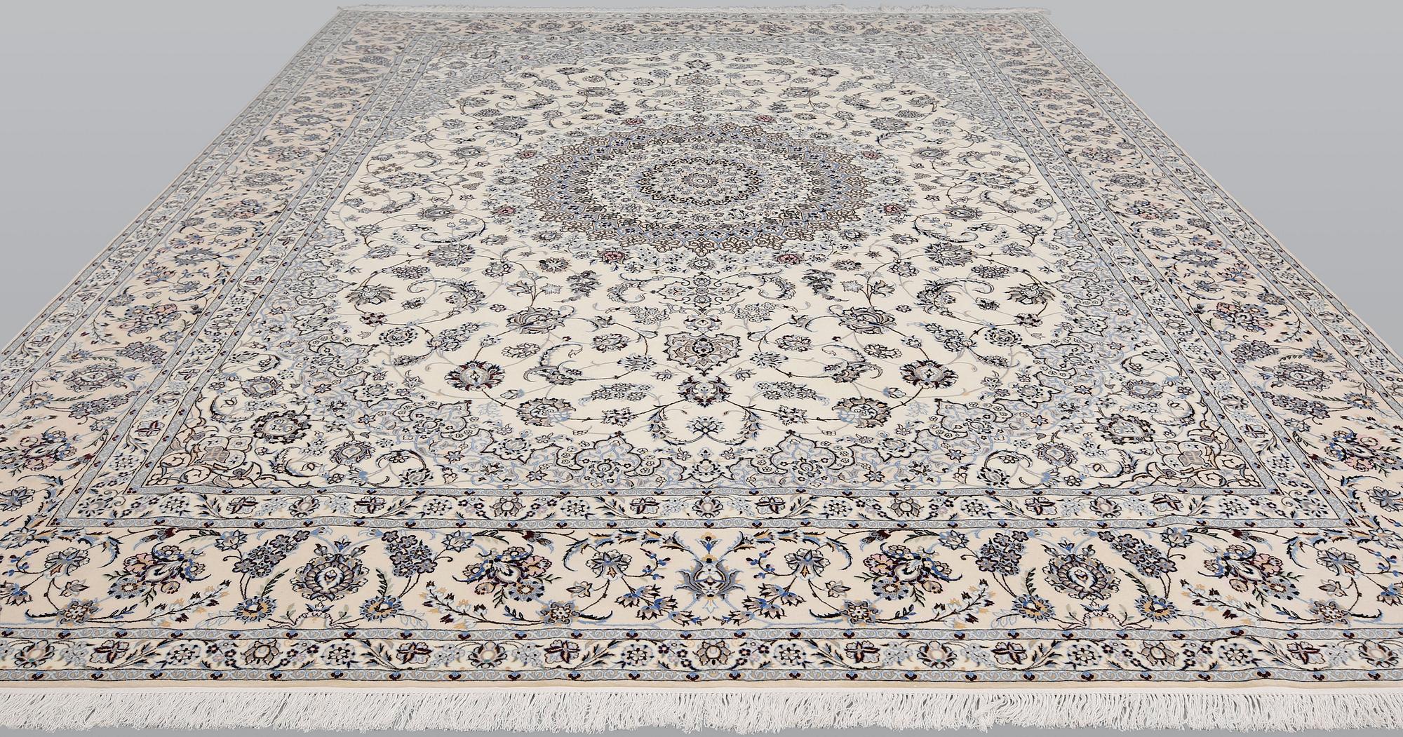 A Nain part silk carpet, 408 x 308 cm.