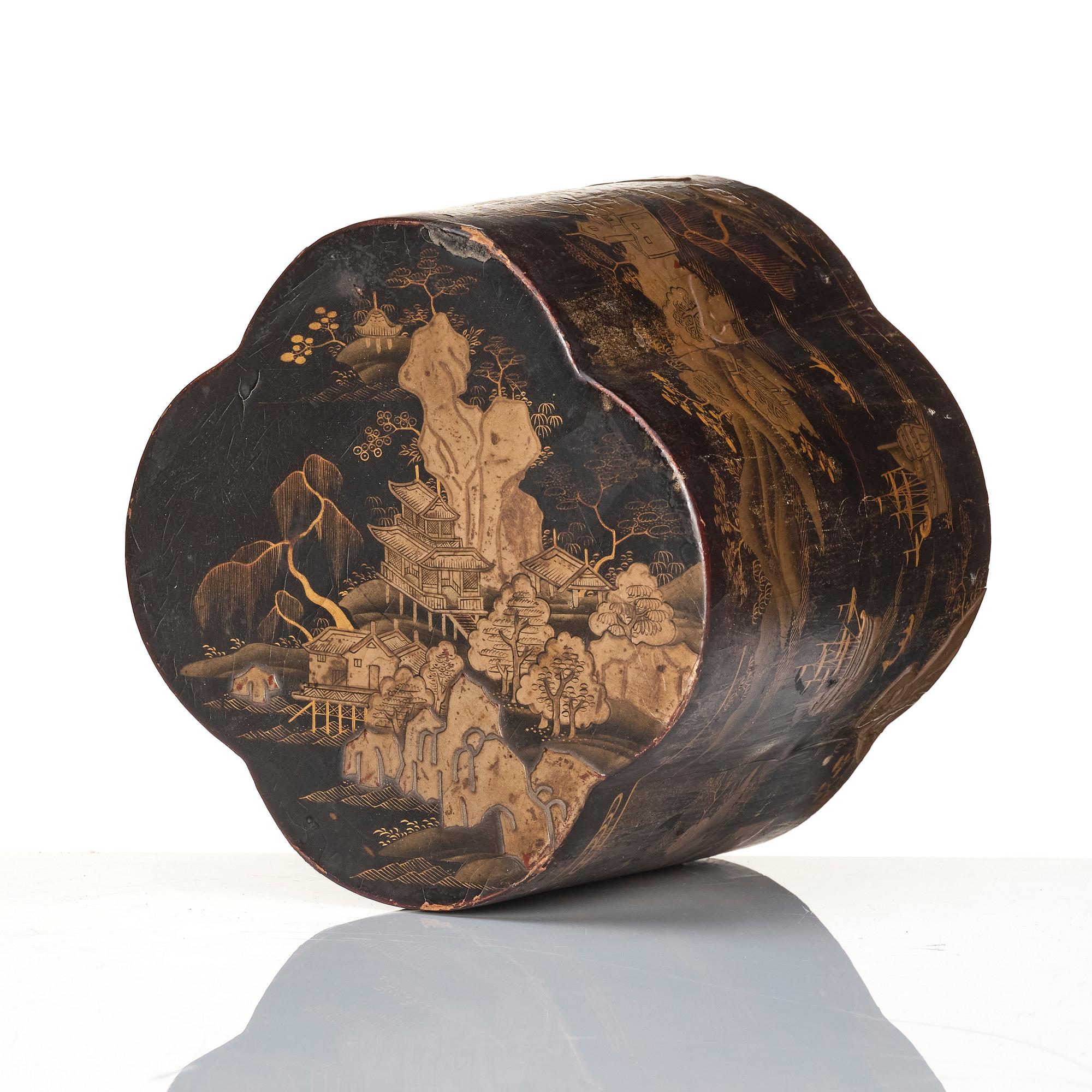 A Chinese lacquer box with a set of five pewter tea caddies, Qing dynasty, 18/19th Century.