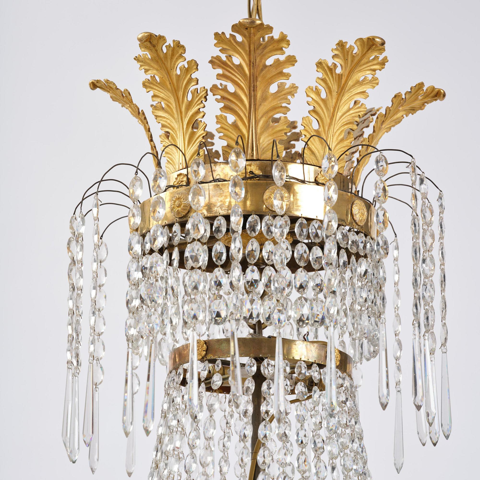 An ormolu and cut glass sixteen-branch Empire chandelier, Paris, early 19th century.