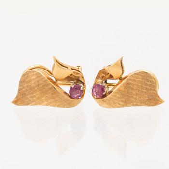 A pair of 18K gold earrings.