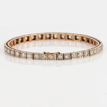 A 14K gold bracelet set with old-cut diamonds.