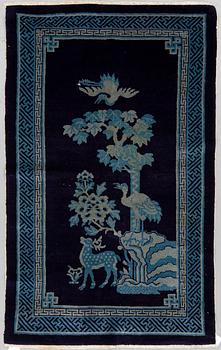 A RUG, a semi-antique Baotou, China, ca 198 x 98 cm.