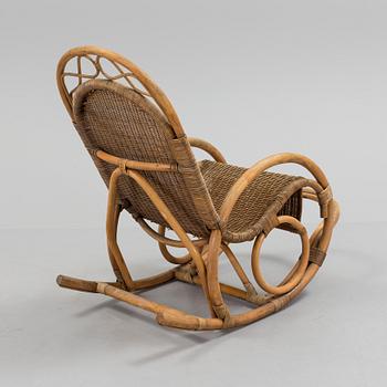 a rattan and bamboo rocking chair from the second half of the 20th century.