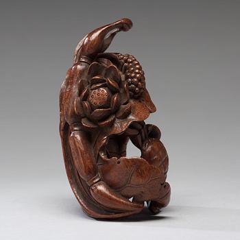 A bamboo carving of a crab and lotus, late Qing dynasty.