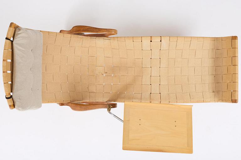 Bruno Mathsson, a lounge chair with wheels, Firma Karl Mathsson, Värnamo, 1940s, with reading table from 1972.