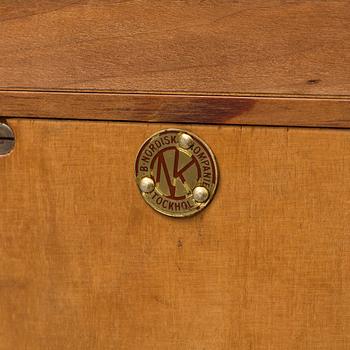 A mid 20th century cabinet veneered with walnut from Nordiska Kompaniet in Stockholm.