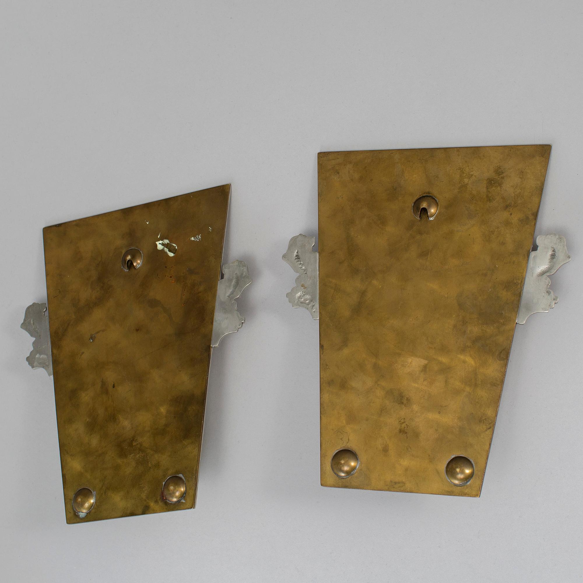 A pair of wall sconces by CG Hallebrg dated 1929.