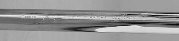 A Le Corbusier 'LC 7' chromed steel and white leather chair, Cassina, Italy.