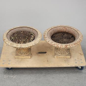 A pair of cast iron plat pots.